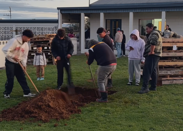 Traditional Maori Hangi Preparations For International Student Group