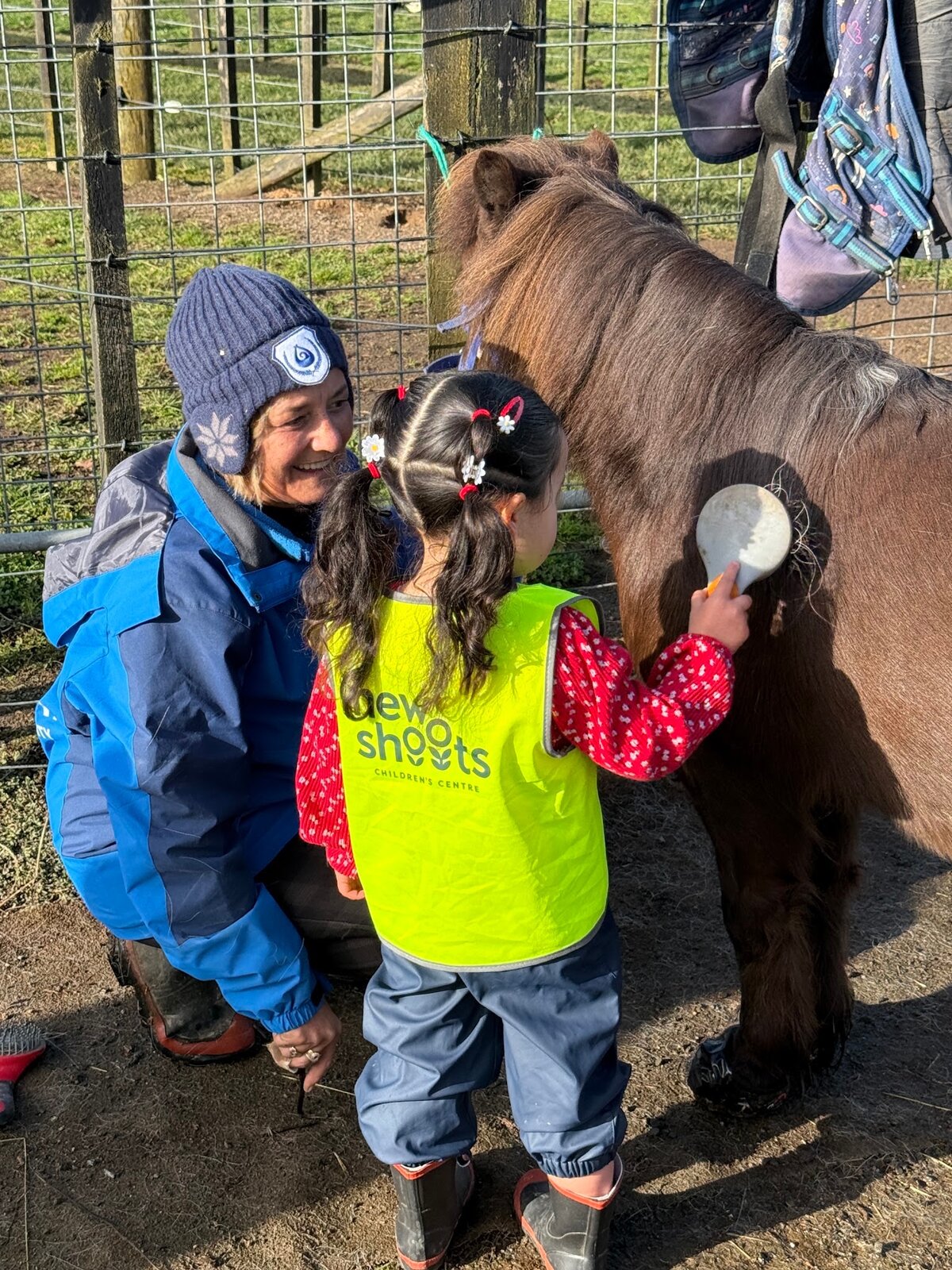 Youngest Volunteers Learn Horse Grooming